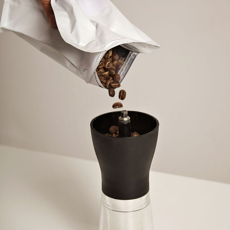 Pouring Coffee To Grind